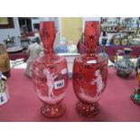 A Pair of XIX Century Cranberry Glass Spill Vases, with Mary Gregory style figures to ovoid body,