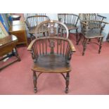 A XIX Century Ash Elm Windsor Chair, with a hooped back, pierced splat, rail supports on turned