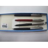 Three Parker Ball Point Pens; together with a pencil. (4)