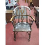 A XIX Century Ash Elm Windsor Chair, with a hooped back, pierced splat, rail supports, on turned