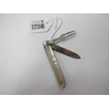 A Mother of Pearl Fruit Knife, incorporating silver blade and silver fork, silver bolsters to one
