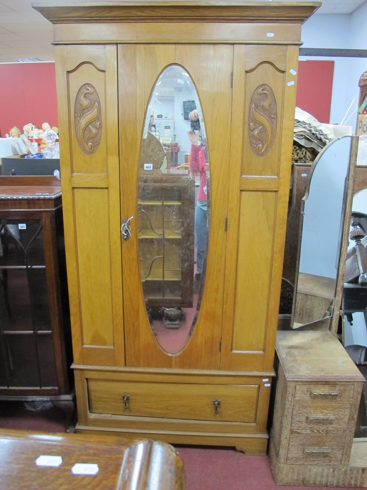 Early XX Century Light Oak Wardrobe, with a oval mirror, long drawer, plinth base, 198cm high.