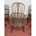 A XIX Century Ash Elm Windsor Chair, with hooped back, pierced splat, rail supports, on turned legs,