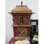 A Late XIX Century Oak Cased Mantle Clock, probably Bavarian with soldier automation behind door