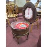 An Early XX Century Mahogany Sewing Table, with a hinged lid, on cabriole legs.