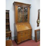 Early XIX Century Oak Bureau Bookcase, with mahogany cross banding, dental cornice, astragal