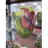 W Moorcroft Vase, with a yellow green ground, Hibiscus style flowers, paper label to base. W