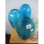 Three Turquoise Glass Vases, of ovoid form, with green entwined decoration, 27cm high.