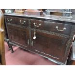 Early XX Century Mahogany Sideboard, with a low back, two top drawers, over cupboard doors, on