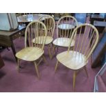 Ercol Four Blonde Hoop Back Dining Chairs, with rail spindles, on splayed legs, each baring silvered