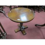 An Oak Coffee Table with a circular top,turned pedestal on quatrefoil base, 46cm wide x 47cm high.