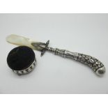 A Hallmarked Silver Handle Letter Opener, of textured pistol design, and mother of pearl blade/