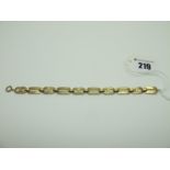 A Geometric Link Bracelet, stamped "9ct", to clasp stamped "9c" (overall length 19cm) (7.5grams).