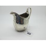 A Hallmarked Silver Jug, (makers mark rubbed) possibly London 1799, foliate engraved with prick