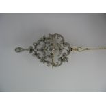 An Edwardian Diamond Set Pendant/Brooch, of openwork scroll design, graduated set throughout with