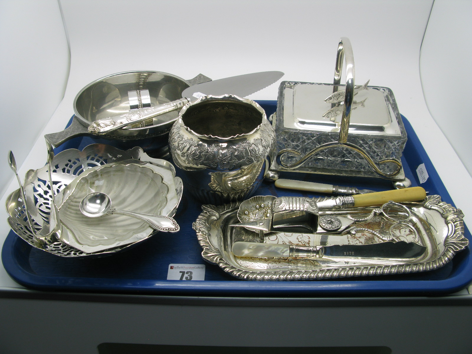 A Sardine Dish on Plated Stand, a mother of pearl handled sardine fork, a hallmarked silver