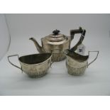 A Hallmarked Silver Three Piece Bachelor's Tea Set, (marks completely rubbed) of oval semi reeded