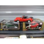 Three 1/18th Scale Diecast Vehicles, a Volkswagen Sedan by Maisto, boxed, a Volkswagen 'New'