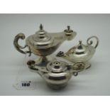Three Hallmarked Silver 'Genie' Lamp Lighters, largest 15.5cm long, with flying scroll handle,