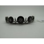 A Decorative XIX Century Cut Steel Tiara, of openwork graduated design, with black disc details (