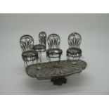 A Continental Miniature Filigree Table and Four Chairs, table length 9.5cm, chairs approximately 6.