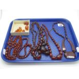 Cherry Amber Coloured Bead Necklaces, (one string broken/loose beads):- One Tray