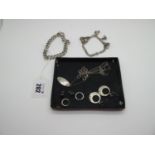 A Double Curb Link Charm Bracelet, suspending five assorted novelty charm pendants, a curb link