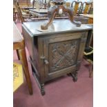 Oak Cupboard, with fall flaps, carving to single door, on turned and block supports, 77cm high.