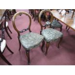 A Set of Five Late Victorian Walnut Parlour Chairs, with scroll carving to balloon backs, plus spare