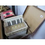 Rosetti Accordian, in a brown case.