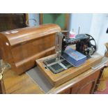 An Early XX Century Vesta Sewing Machine, in a walnut case.