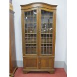 Early XX Century Oak Book Cabinet, with arched top, leaded glazed and panelled doors, retail