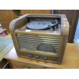 Bell Walnut Cased Radiogram, stamped "G & T 060", tambour fronted, the turntable arm attachment