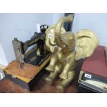 A Brass Elephant 39cm high. Singer Sewing Machine, (no cover). (2)