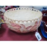 A Royal Worcester Porcelain Circular Bowl, with a pierced rim, blush ivory basket work, ground