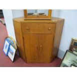 An Oak Corner Cupboard, in the E. Gomme manner with fall front drawer over cupboard doors, 94.5cm