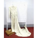 A 1930's Wedding Dress, in cream and silver, with full length sleeves, button back and belted