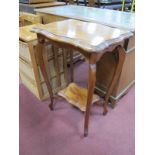 Early XX Century Occasional Table, with serpentine shaped top and undershelf united by sabre legs,