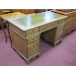 Twin Pedestal Desk, with green leather inset top, swan neck handles to eight drawers.