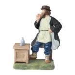 A RUSSIAN PORCELAIN FIGURE OF A PEASANT WITH A PIPE, GARDNER PORCELAIN FACTORY, MOSCOW, 1870-1890S