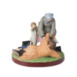 A RUSSIAN PORCELAIN FIGURAL GROUP OF A PEASANT WOMAN PICKING UP HER DRUNKARD HUSBAND