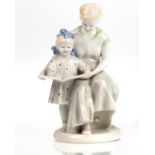 A SOVIET PORCELAIN FIGURAL GROUP OF A MOTHER AND DAUGHTER READING, POLONSKY PORCELAIN FACTORY