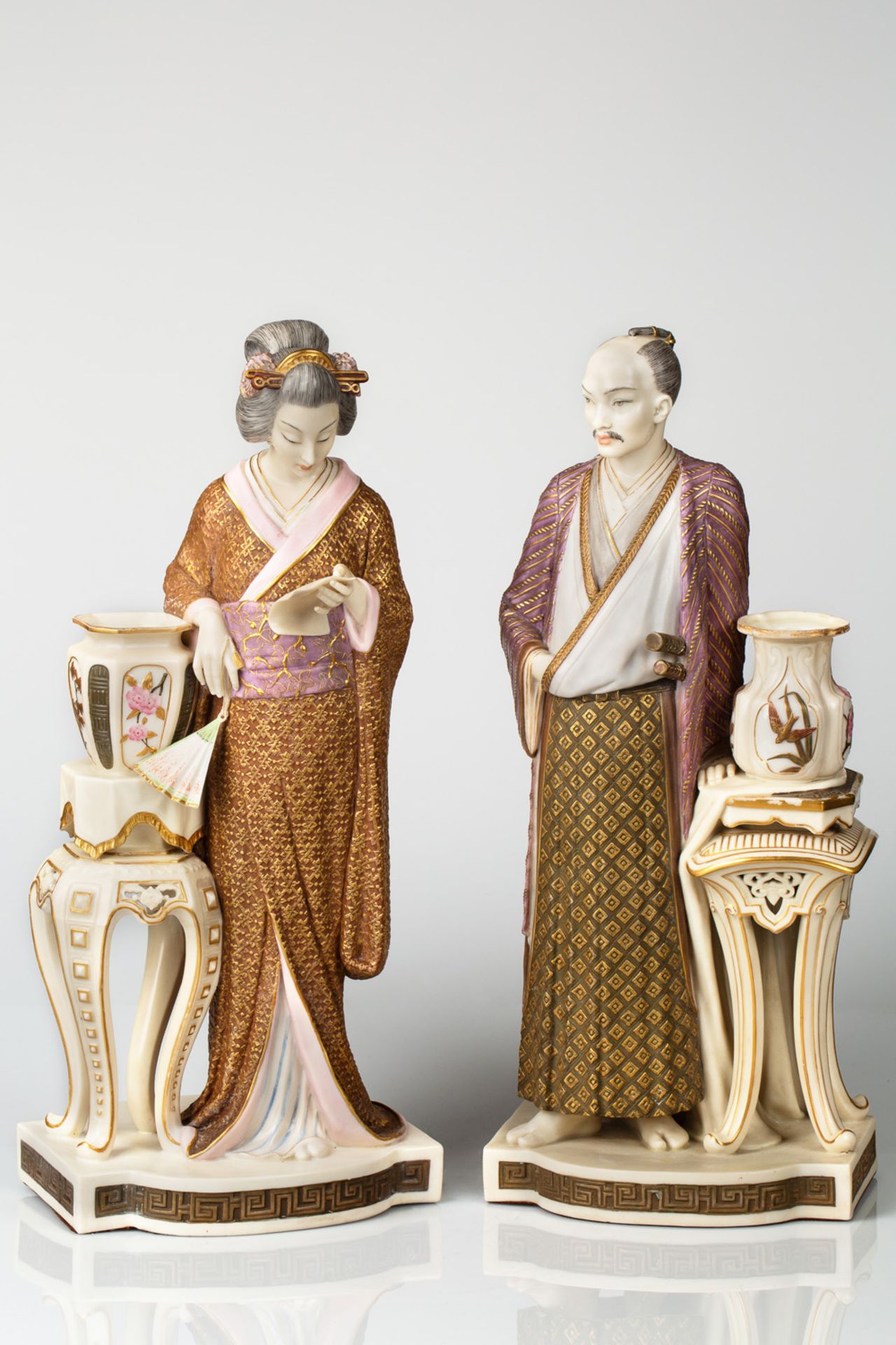 A PAIR OF FIGURES OF A JAPANESE MAN AND WOMAN AFTER JAMES HADLEY (BRITISH 19TH CENTURY)