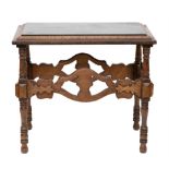 AN ENGLISH ARTS AND CRAFTS CARVED AND MARBLE-INSET SIDE TABLE