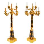 PAIR OF FRENCH EMPIRE GILT-BRONZE AND EBONISED SEVER-LIGHT TORCHIERES