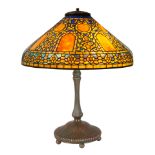 A RARE TIFFANY STUDIOS LEADED GLASS AND BRONZE "RUSSIAN" TABLE LAMP, NEW YORK, 1910