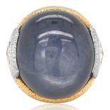 A 35.00CT STAR SAPPHIRE GOLD PLATINUM AND DIAMOND RING