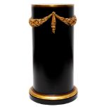 A ROUND EBONIZED NEOCLASSICAL PEDESTAL WITH WREATH