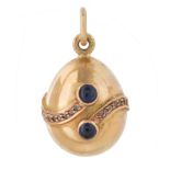 A RUSSIAN YELLOW AND ROSE GOLD, SAPPHIRE AND DIAMOND EGG PENDANT, WORKMASTER AUGUST HOLLMING, ST. PE