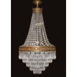 LARGE EDWARDIAN CRYSTAL AND BRASS CHANDELIER